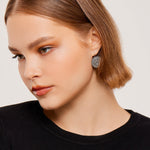 Circular Sterling Silver earrings with a shiny and polished finish by Gexist®