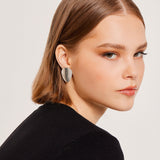 Ear clips in Sterling Silver with a satin finish for subtle elegance by Gexist®