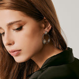 Sterling Silver Stud Earrings with three Bicolor satin Edelweiss on two shiny asymmetrical Hoops by Gexist®