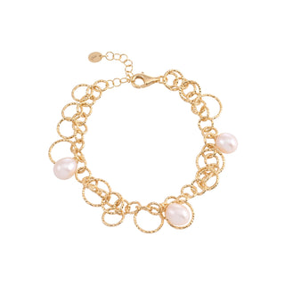 Sterling Silver bracelet with yellow gold plating and a shiny, diamond-cut finish, featuring multiple round rings of different sizes and teardrop-shaped freshwater pearls by Gexist®