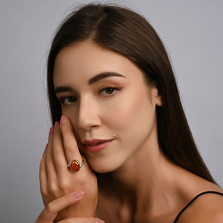 Sterling Silver ring featuring a designer ring with a shiny finish and a magnificent oval Amber cab by Gexist®