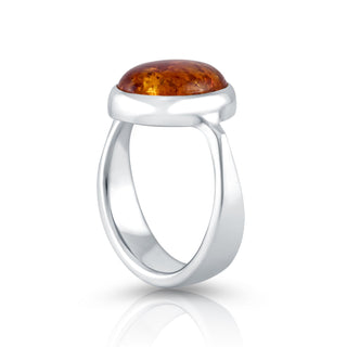 Sterling Silver ring featuring a designer ring with a shiny finish and a magnificent oval Amber cab by Gexist®