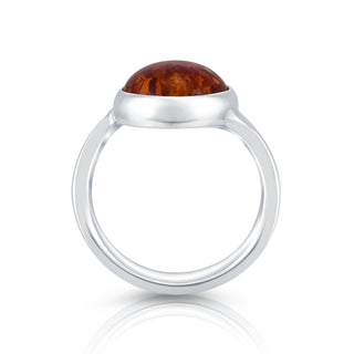 Sterling Silver ring featuring a designer ring with a shiny finish and a magnificent oval Amber cab by Gexist®