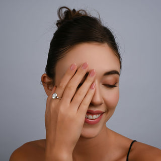 Sterling Silver ring featuring a designer ring with a shiny finish on which is set a magnificent oval Mother-of-Pearl cab by Gexist®