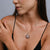 Sterling Silver round filigree pendant with sky blue Topaz cab stone by Gexist®