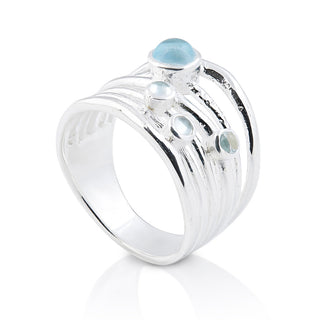 Sterling silver ring with 3mm and 6mm blue topazes on several bands by Gexist®