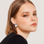 Stud earrings in Sterling Silver finish that combines a soft satin finish by Gexist®