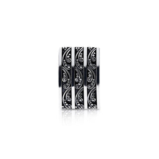 Sterling Silver clip-on earrings in the shape of a slightly curved rectangle, with pretty shiny designs, which embrace the oxidised part of the jewel by Gexist®