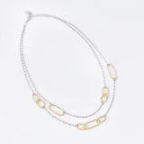 Sterling silver and yellow gold plating necklace, with a double chain made up of several oval, shiny and polished rings of different sizes by Gexist®