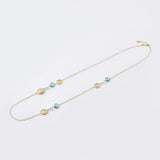 Sterling silver and yellow gold plating necklace, with a modern combination of brushed discs, pearls and faceted blue topaz by Gexist®