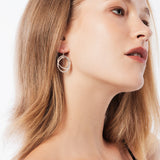 Sterling silver earrings, made of brushed silver wire that intertwines to give this captivating shape by Gexist®