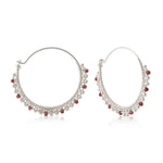 Sterling silver hoop earrings with garnet beads by Gexist®