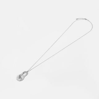 Sterling silver necklace with pendant consisting of an oval shaped element linked to a disc, both with a brushed finish by Gexist®