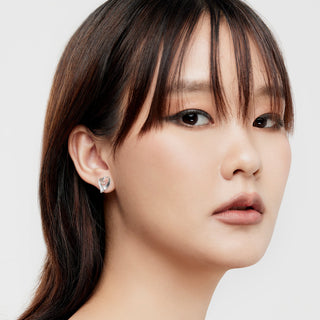 Sterling silver stud earrings in the shape of a heart by Gexist®