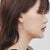 Sterling silver stud earrings with 3 shiny rings by Gexist®